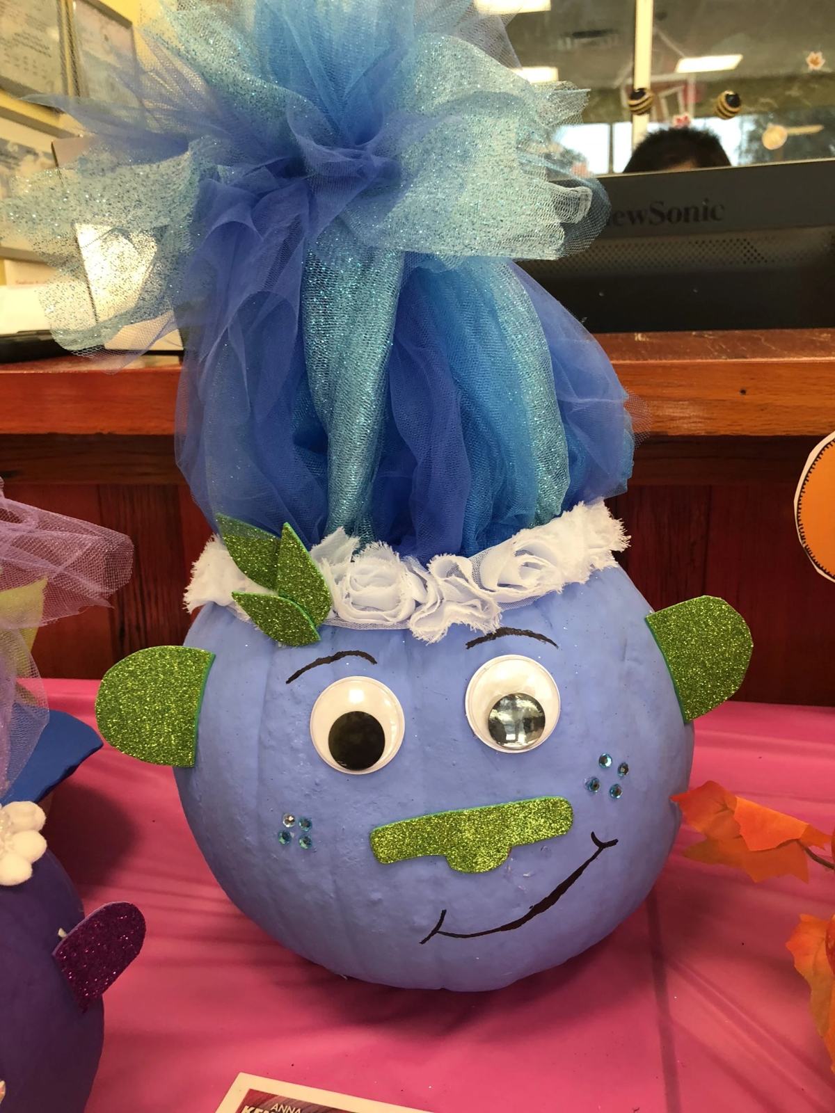 Blue Troll with green glitter foam and blue hair with tulle.