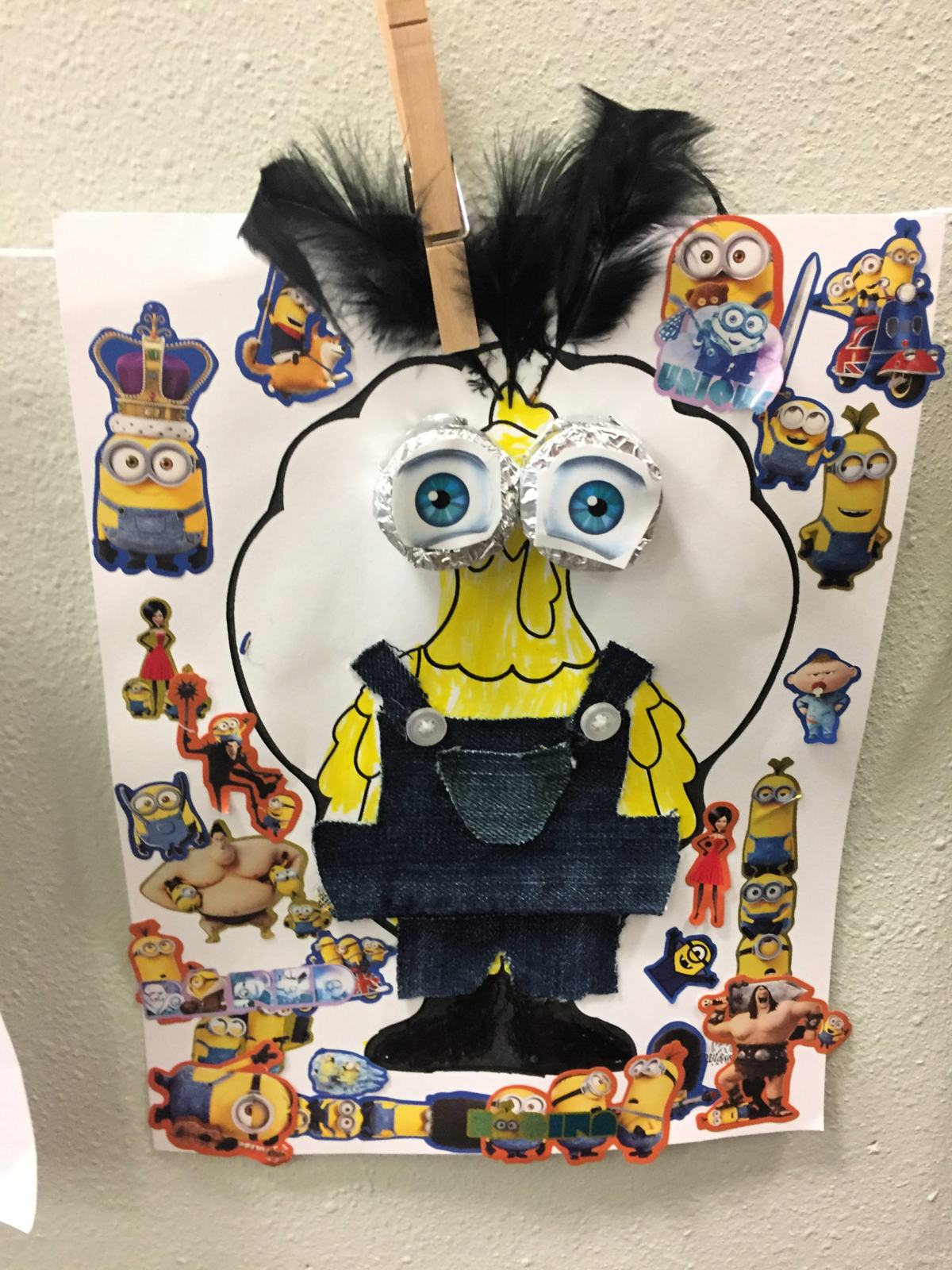 Paper Turkey In Disguise as a Minion with big aluminum foil eyes and minion stickers all over.