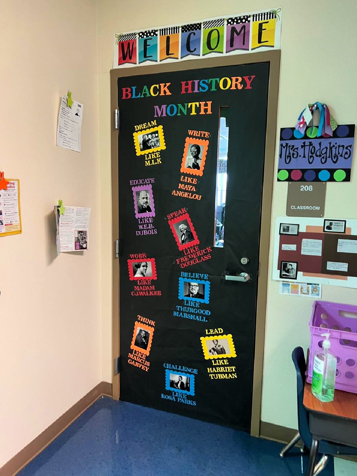 Black door with different black history people on colored paper on the door.