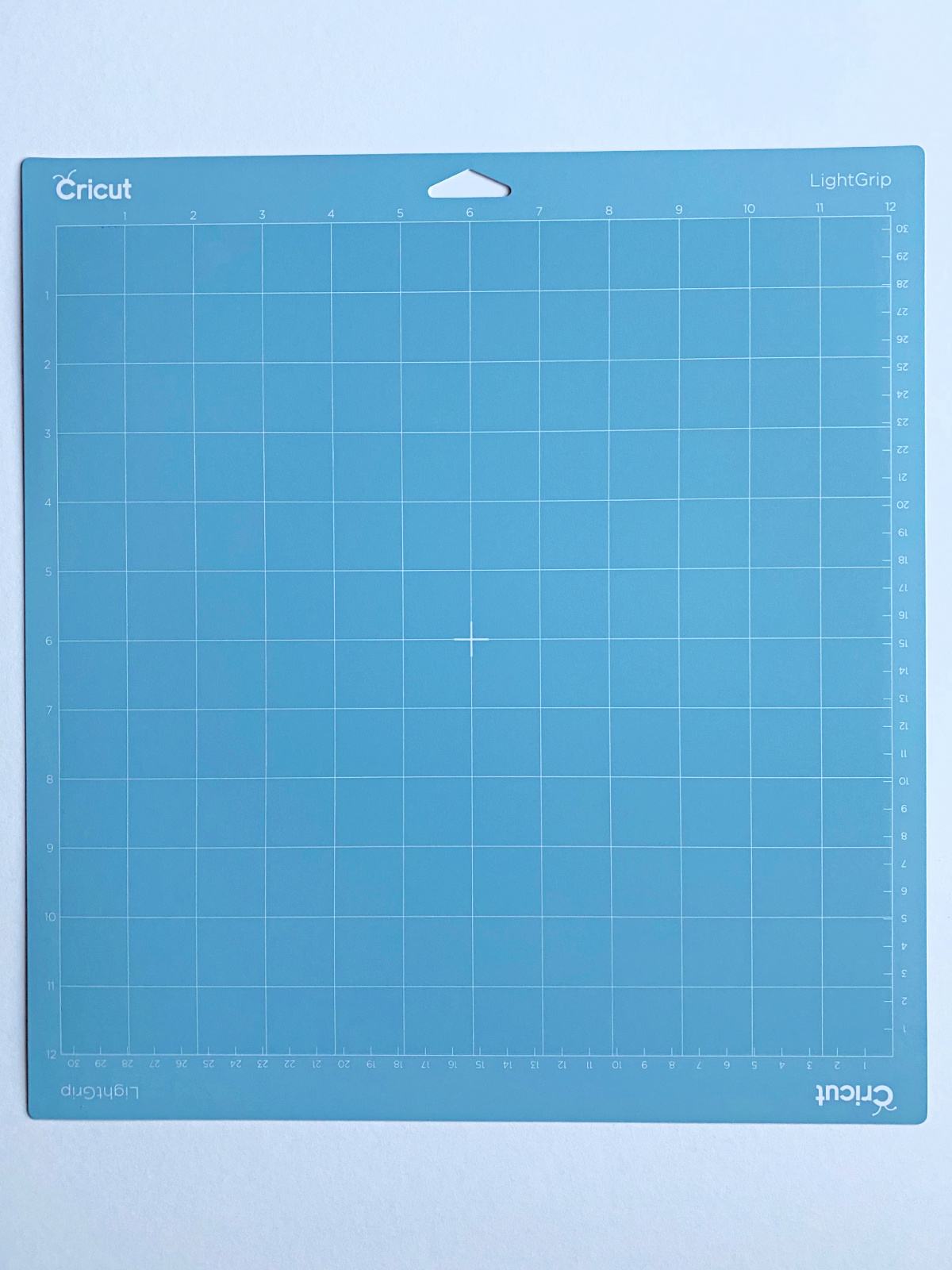 Light blue Cricut LightGrip Mat on a white background.