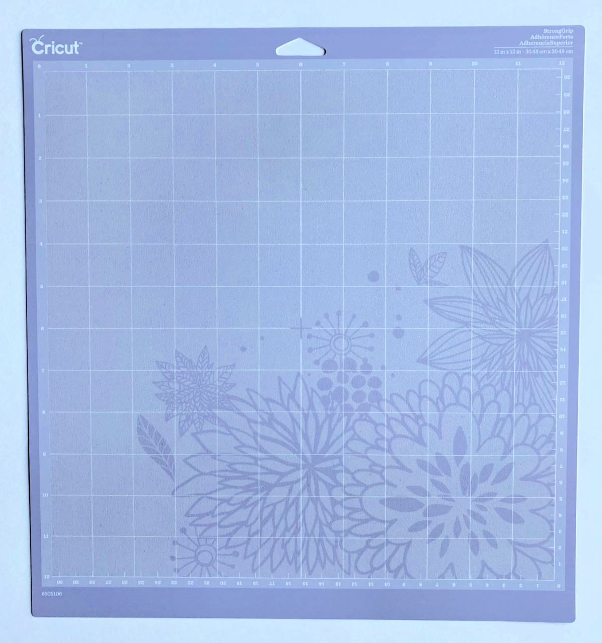 Purple StrongGrip Cricut mat with flowers on it.