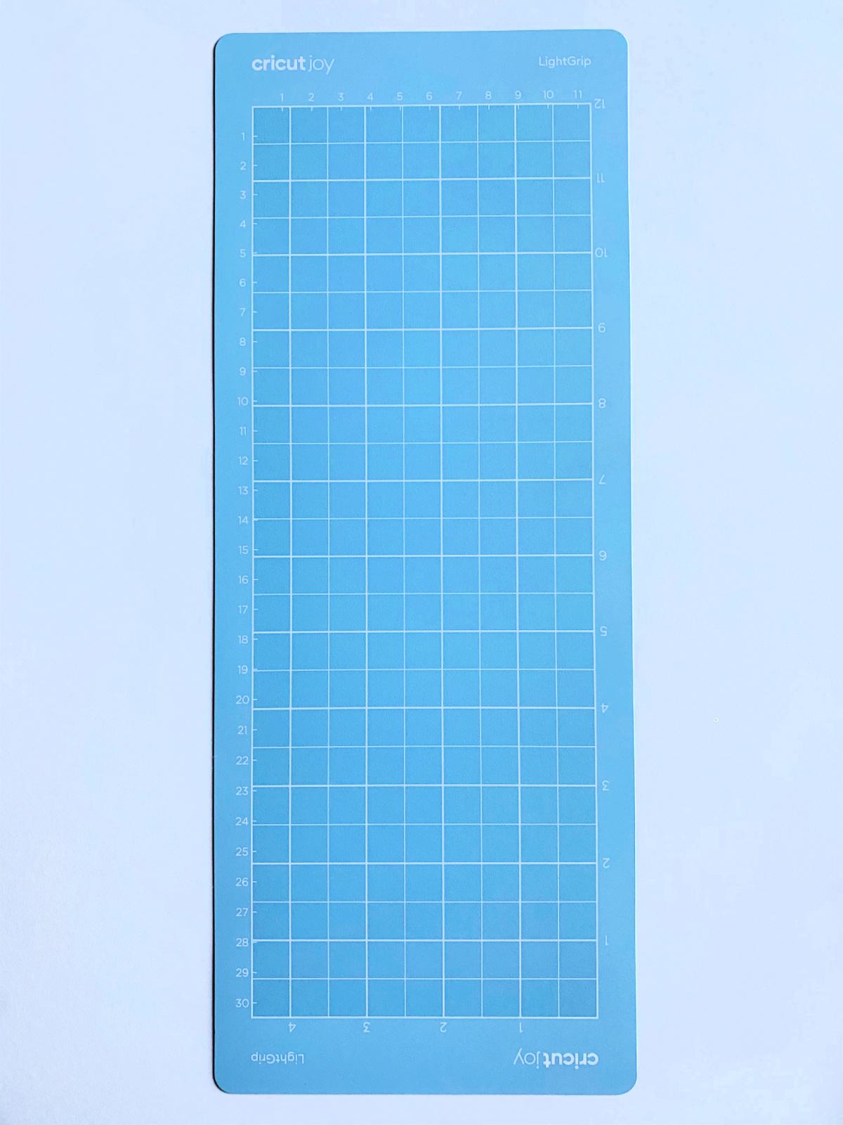 One light blue Cricut Joy LightGrip long mat on a white surface.
