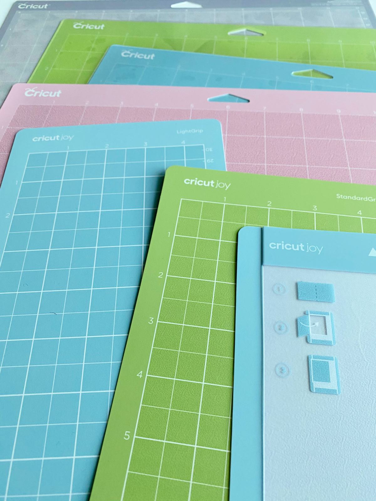 Close up of 7 different Cricut mats.
