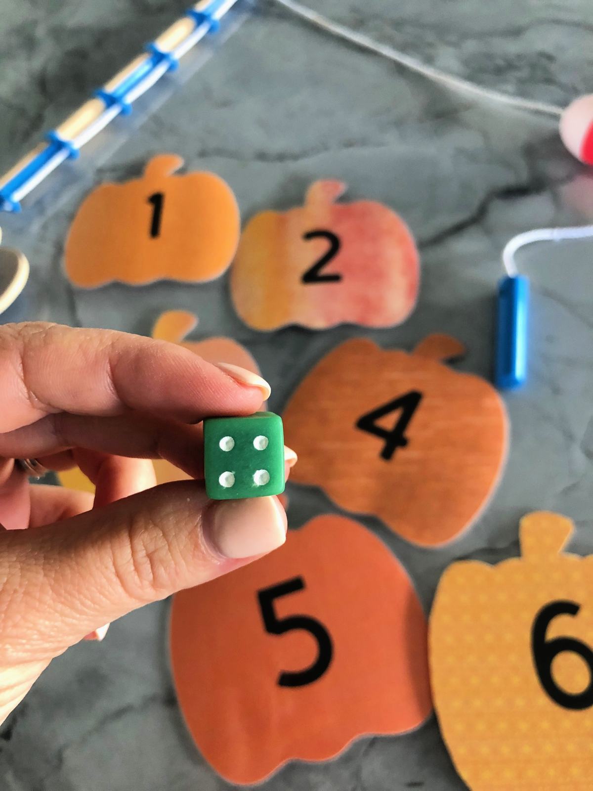 DIY Fishing for Numbered Pumpkins Game using a dice!