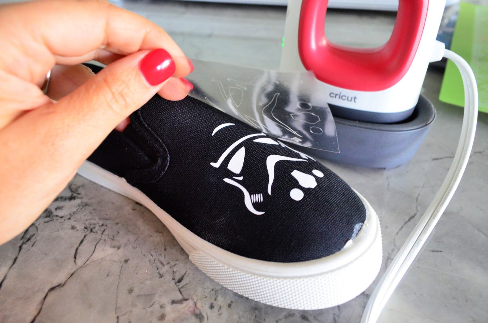 Peeling off the plastic of Iron On Vinyl forStormtrooper Shoes