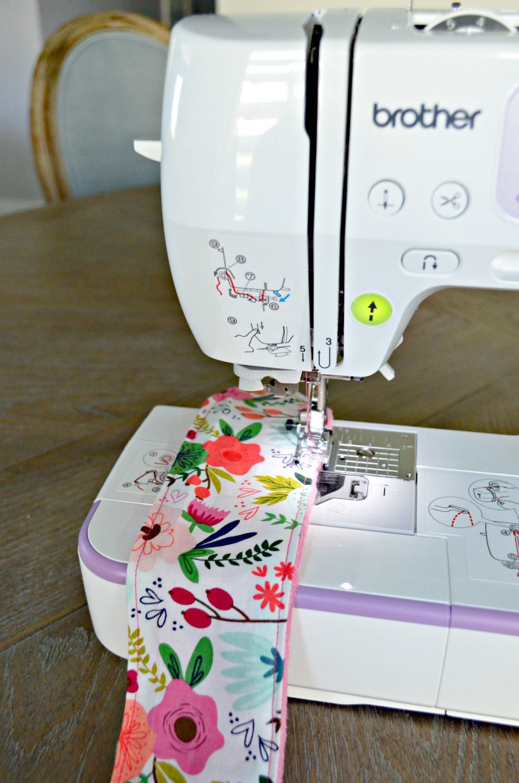 Brother sewing machine sewing around the perimeter of the fabric.