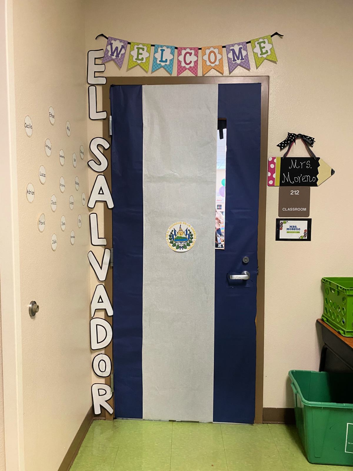 Blue and White classroom door with the words "El Salvador" next to the door.