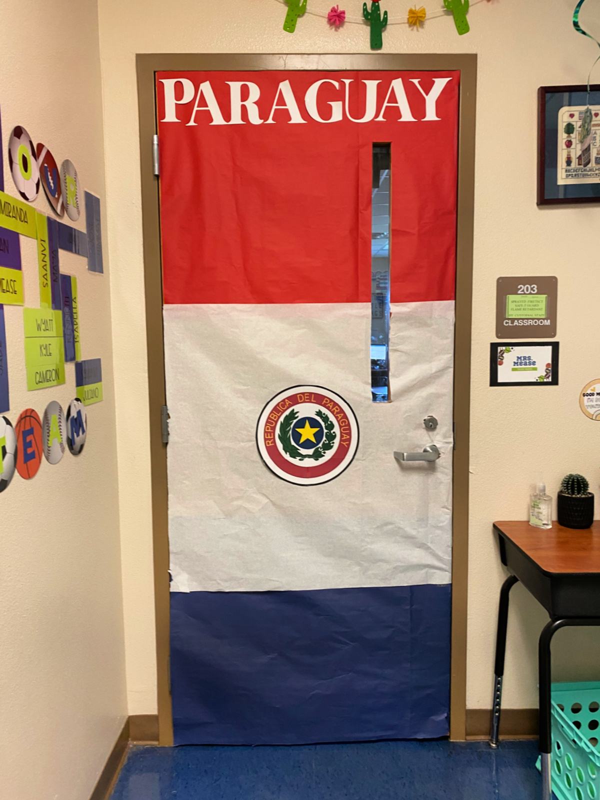 Red, white, and blue flag door that says "Paraguay" with the emblem.