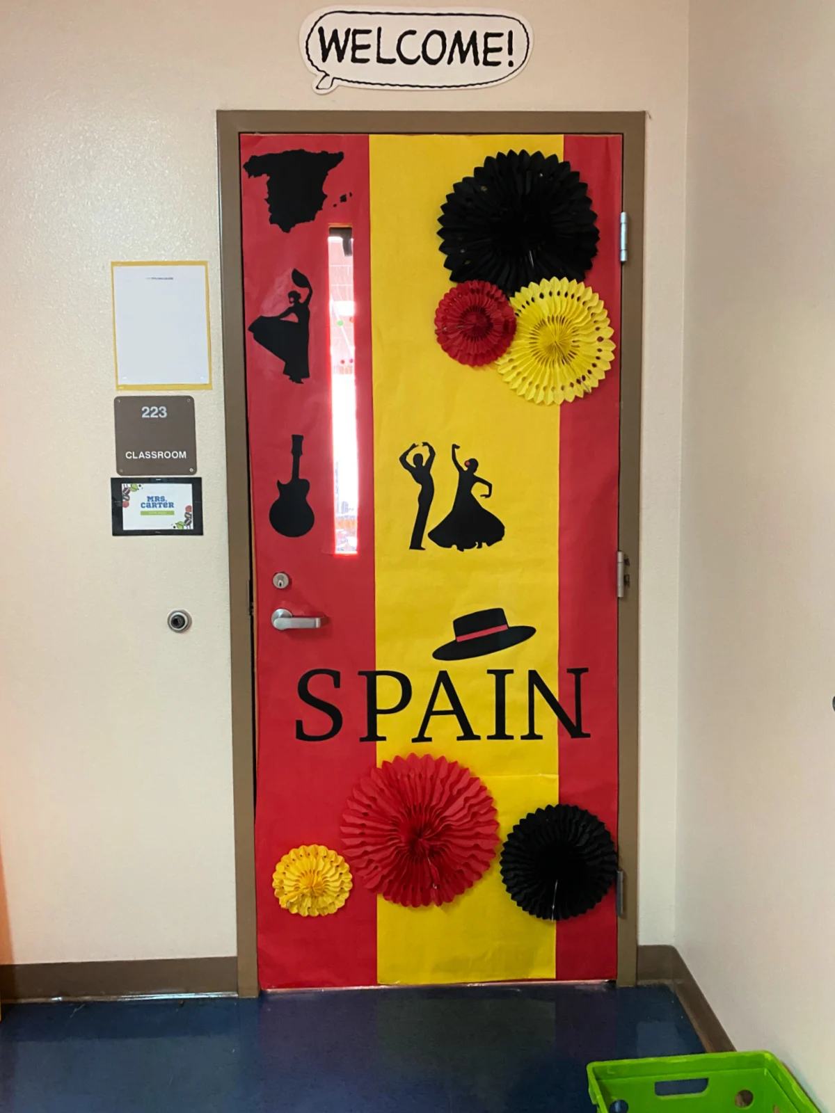 Red and yellow door like the Spain flag with the word "Spain".