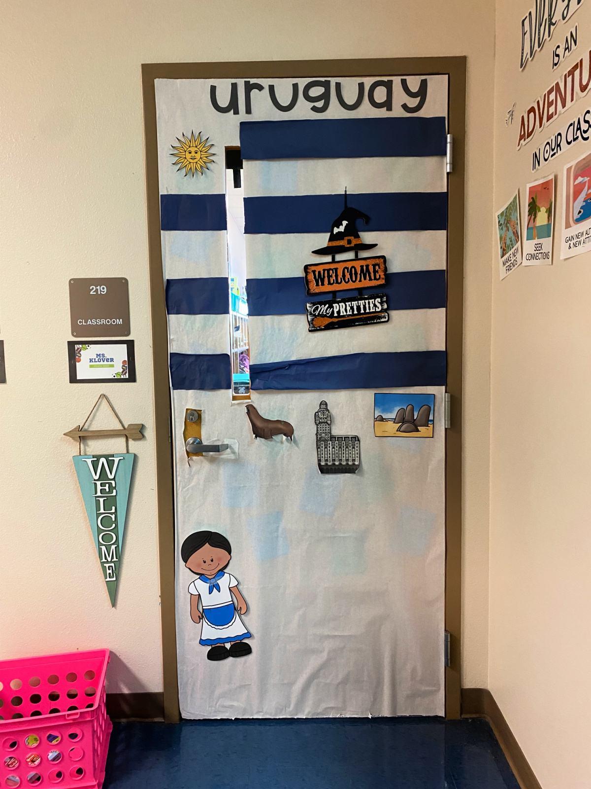 White and blue striped door with the words Uruguay,