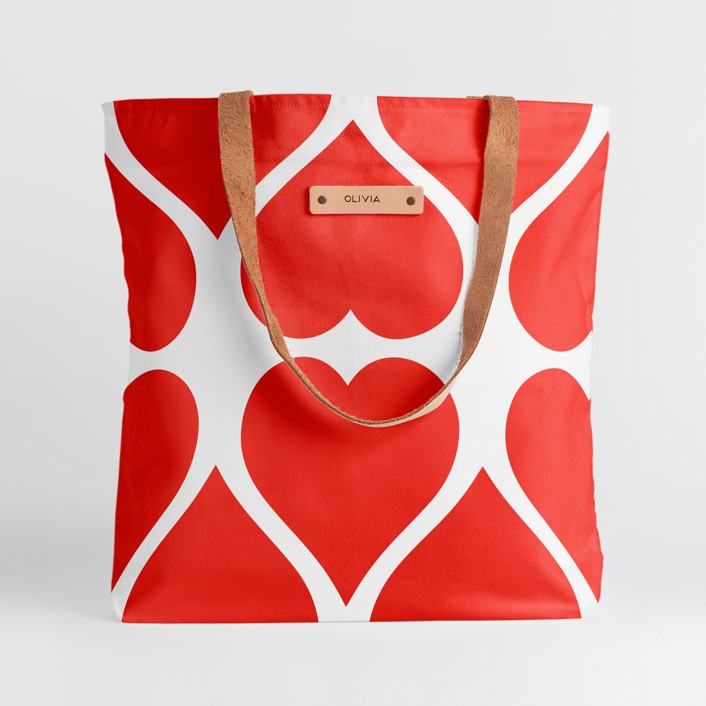 Red and White Striped Bag with a brown strap.