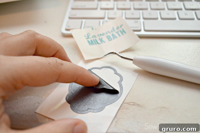 Craft a Custom Lavender Milk Bath 12 Weeding excess vinyl from the DIY Lavender Milk Bath label