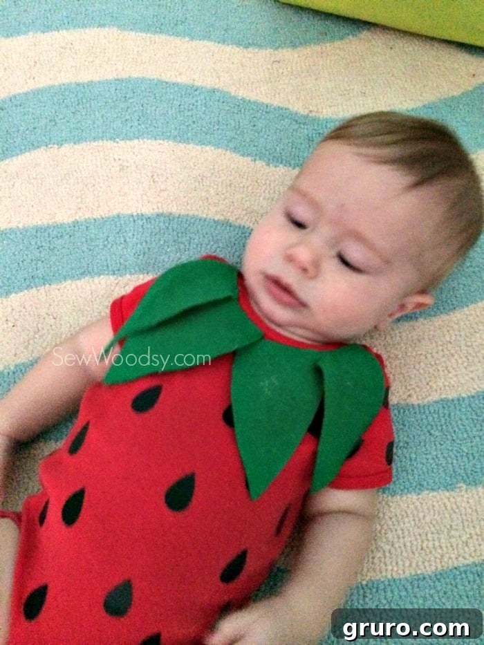 Full view of DIY infant strawberry costume for Halloween