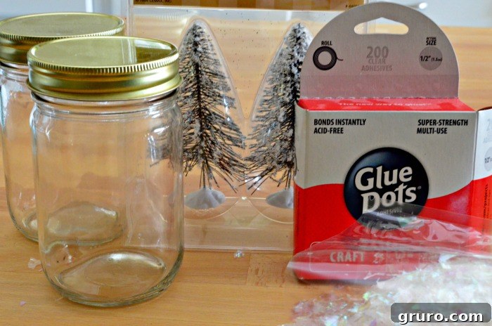 Supplies for Christmas Tree Mason Jars: two clear mason jars, miniature wire bottle brush trees, strong glue dots, and shimmering fake snow.
