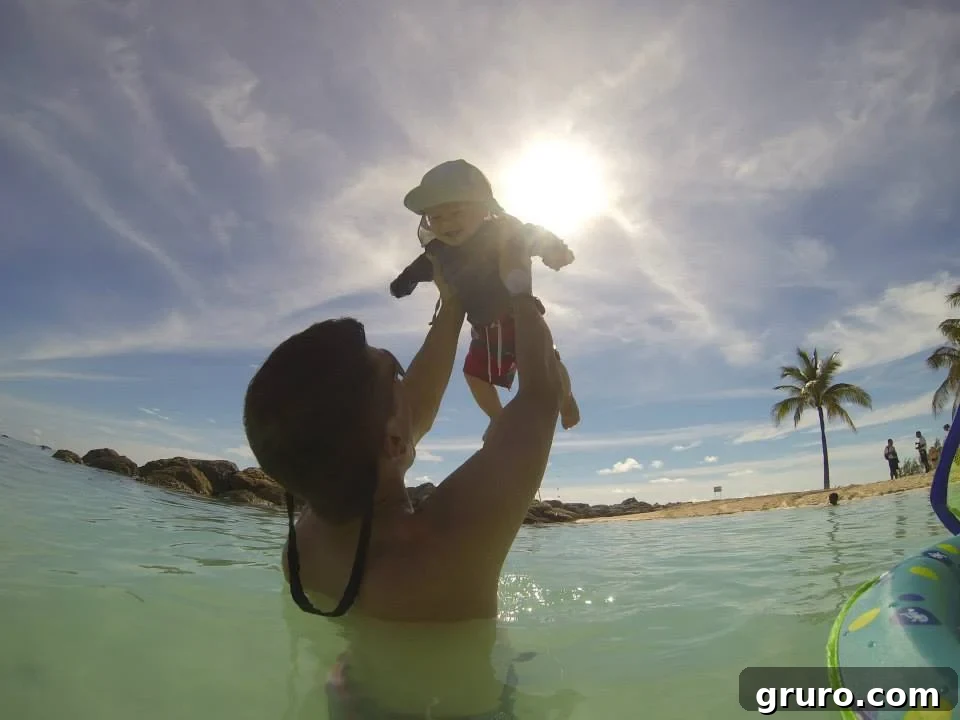 Tiny Traveler's Maiden Voyage 16 Infant Enjoying Water on Coco Cay