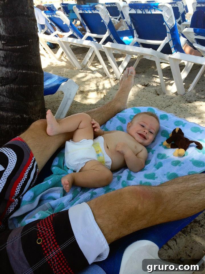 Tiny Traveler's Maiden Voyage 18 Infant Lounging on Beach Chair on Coco Cay