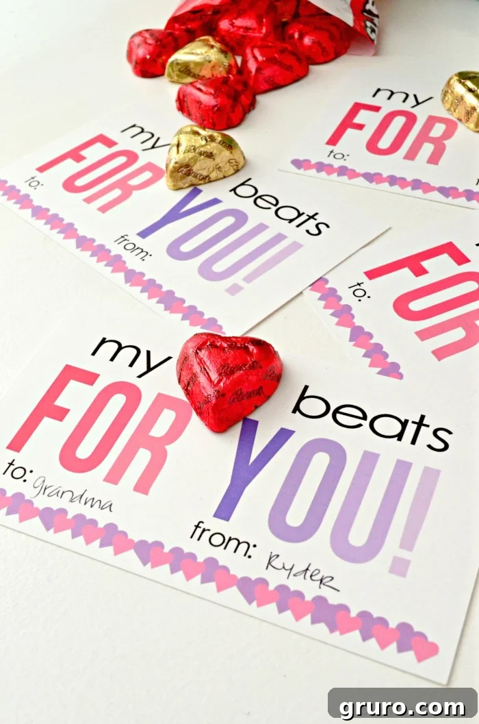 Pitter-Patter Valentine: Classroom Edition 2 Multiple printable valentine cards with Reese's peanut butter hearts candies attached, displayed beautifully.