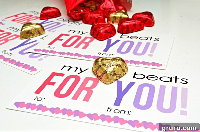 Pitter-Patter Valentine: Classroom Edition 9 Four completed Valentine cards, each with a Reese's Heart, displayed on a clean surface.