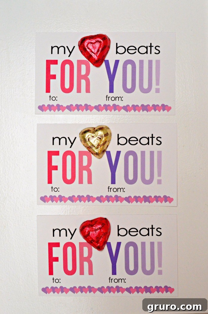 Pitter-Patter Valentine: Classroom Edition 10 Three Valentine cards, each with a Reese's Heart, neatly arranged on a white surface.