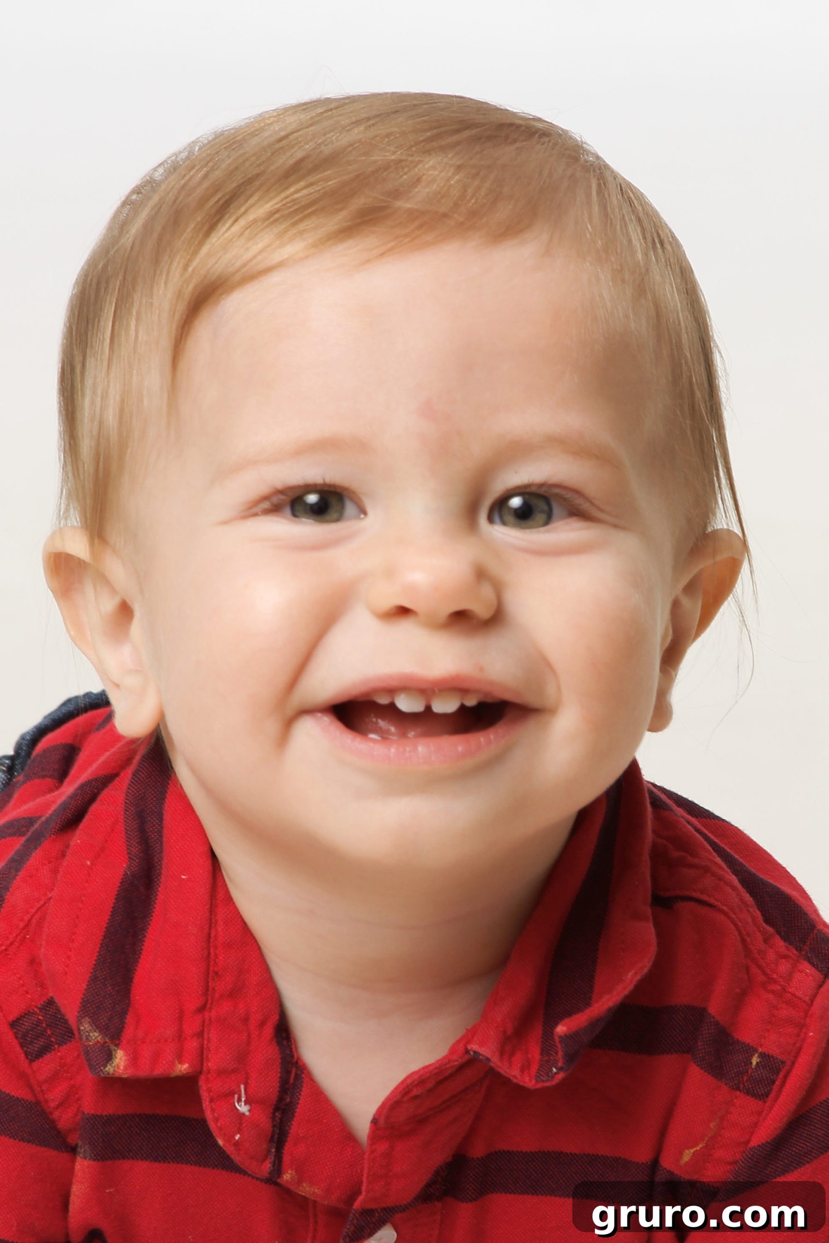 Romance in Focus 8 10-month-old baby boy with blonde hair, displaying a cute expression.