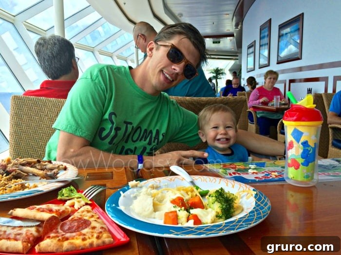 Tiny Explorer's First Voyage: Cruising with a One-Year-Old 12 Father and Son eating lunch on a cruise ship
