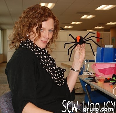 Craft Your Own Fuzzy Spiders 8 Pipe cleaner spiders on a magnetic surface