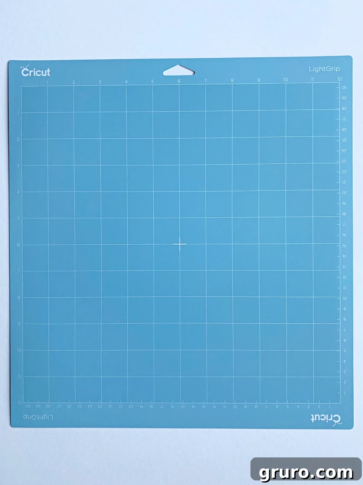 A light blue Cricut LightGrip Mat displayed on a clean white background, highlighting its gentle adhesive surface designed for delicate materials.