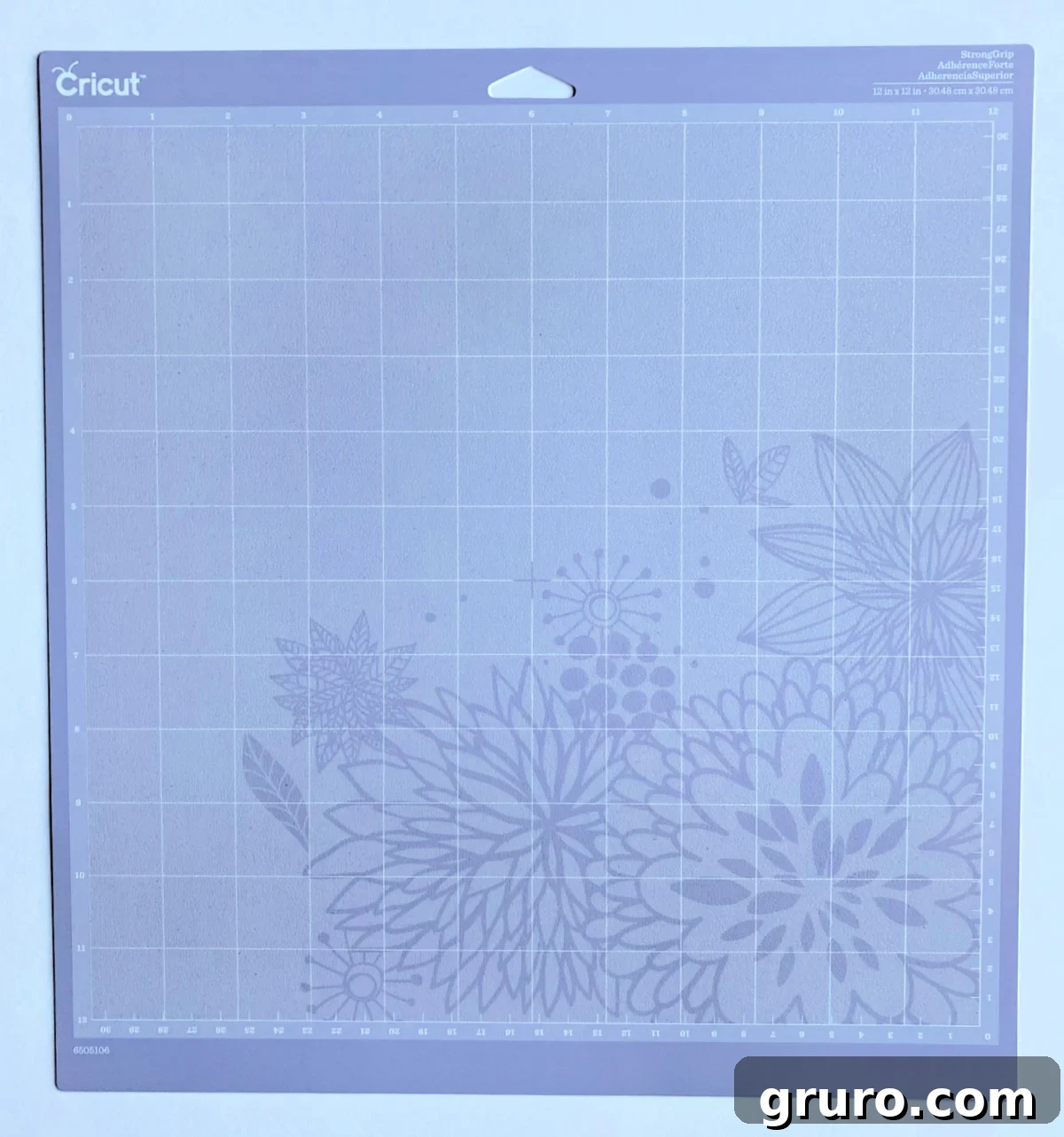 A purple StrongGrip Cricut mat, adorned with a floral design, suggesting its capability to handle robust materials for more intricate or heavy-duty projects.