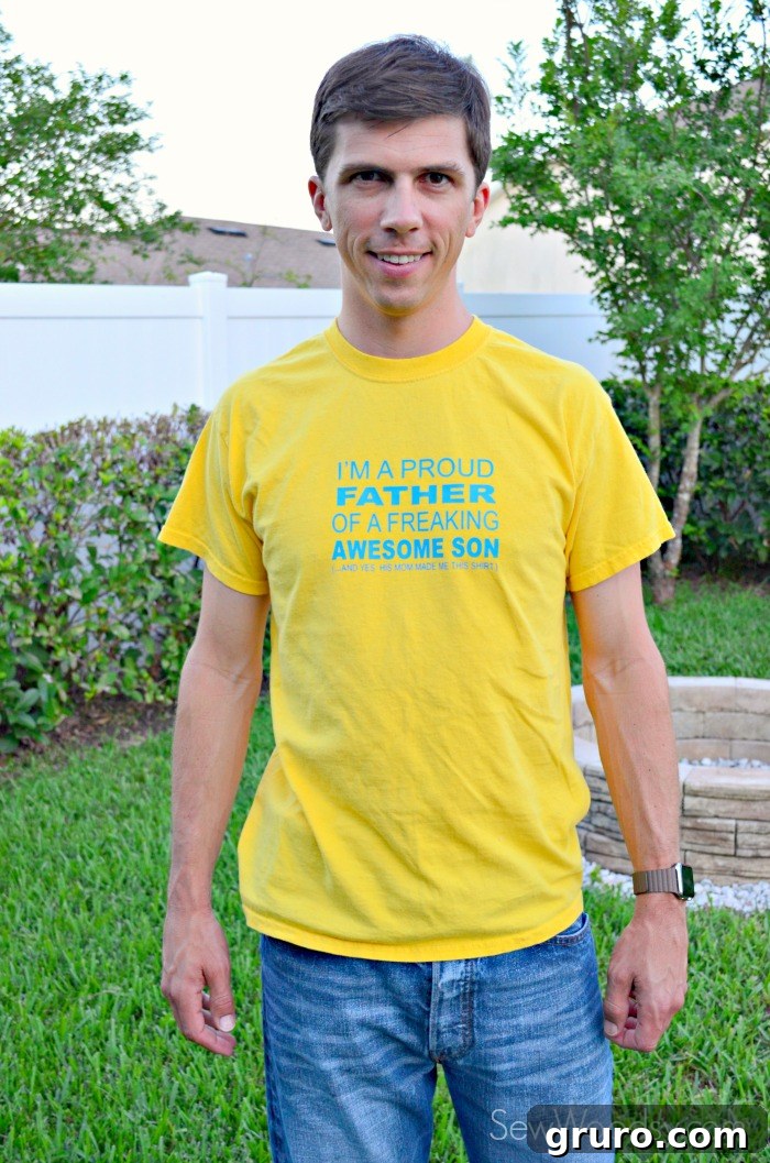 Father holding his baby, who is nearly walking, while wearing the DIY t-shirt