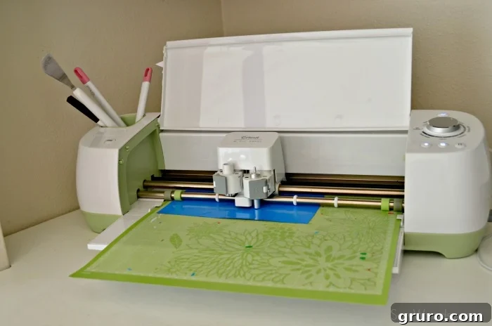 Cricut Explore machine cutting the 'Proud Father' T-shirt design