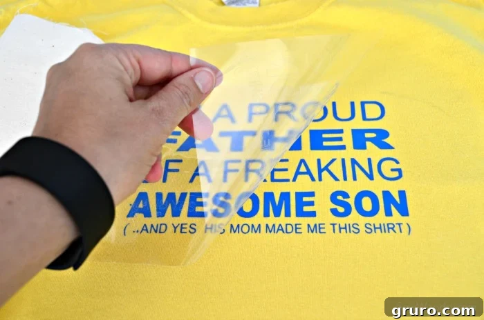 Ironing the 'Proud Father' T-shirt design with protective cloth