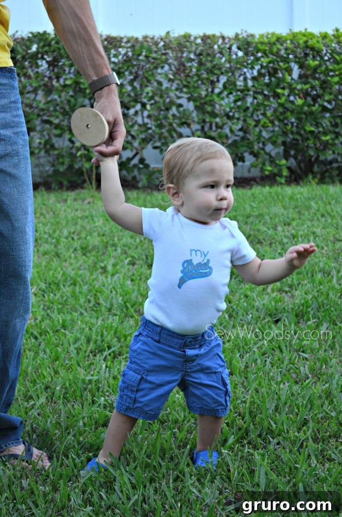 Toddler Ryder on a mini photo shoot wearing 'My Dad Rocks' Onesie