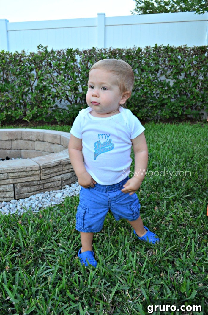 Ryder showing his best modeling pose in 'My Dad Rocks' Onesie