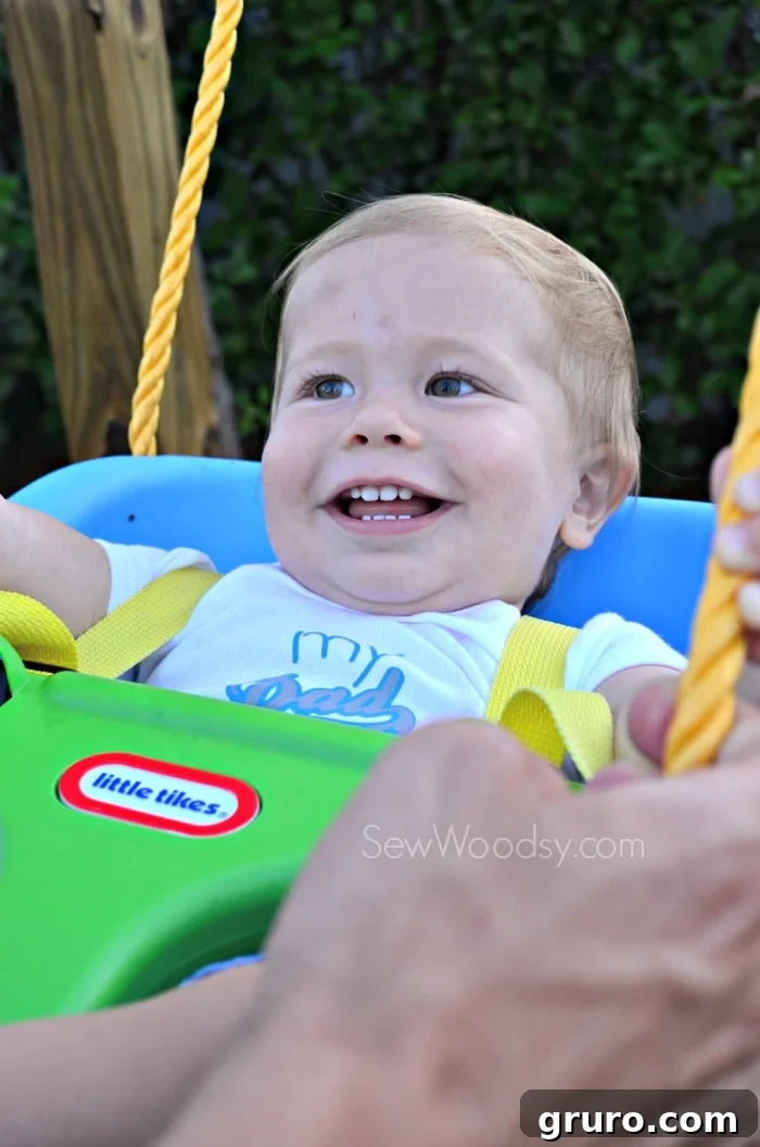 Ryder enjoying a 'roller coaster' ride with Dad wearing his 'My Dad Rocks' Onesie