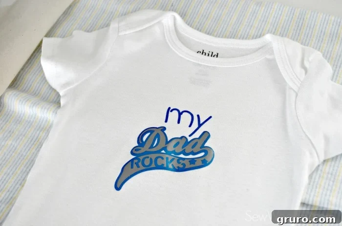 Layering Second Iron-On Vinyl Design on 'My Dad Rocks' Onesie