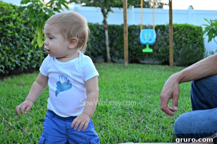 Baby Ryder wearing 'My Dad Rocks' Onesie proudly