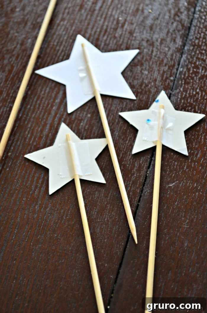 Attaching skewers to patriotic cake topper stars