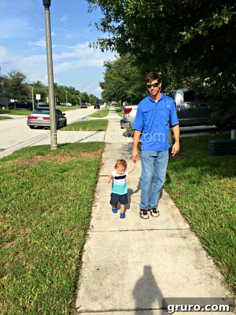 dad and son holding hands