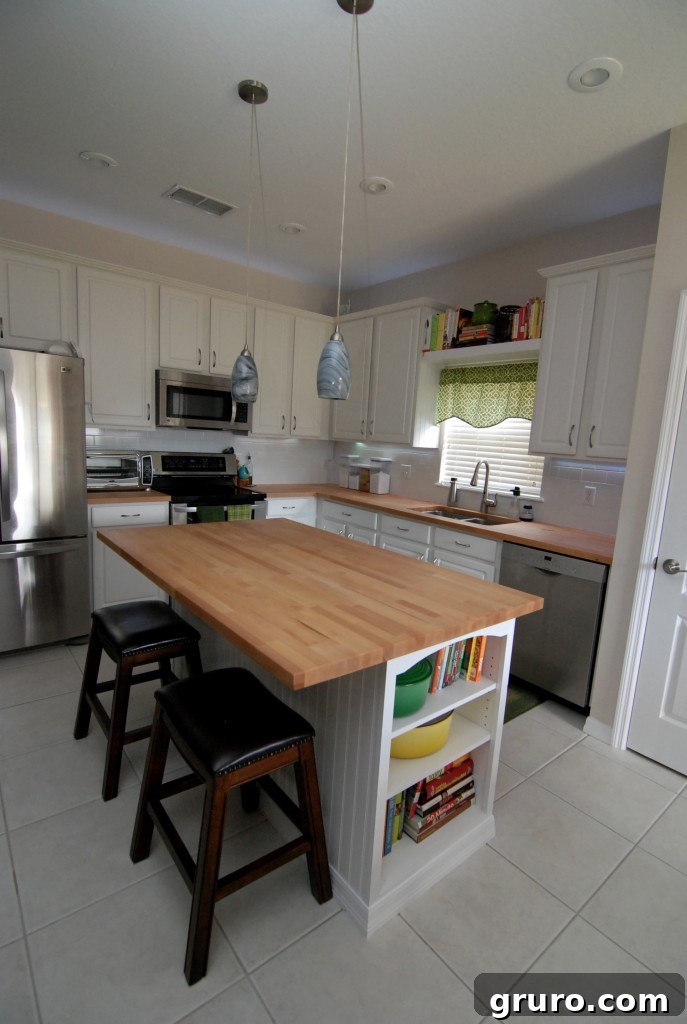 Stylish kitchen island crafted from butcher block, featuring an integrated bookcase