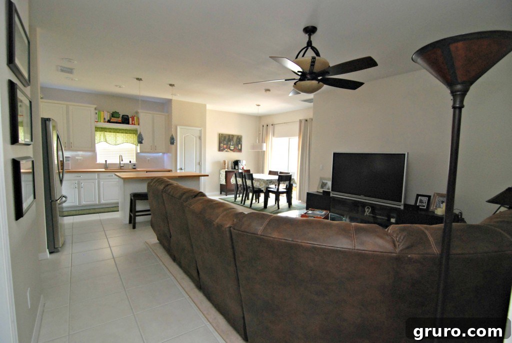 Inviting living room looking towards a brightly lit kitchen