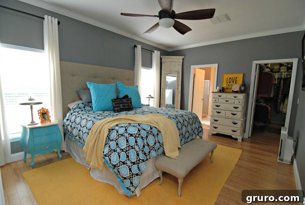 Spacious and serene master bedroom with a comfortable bed
