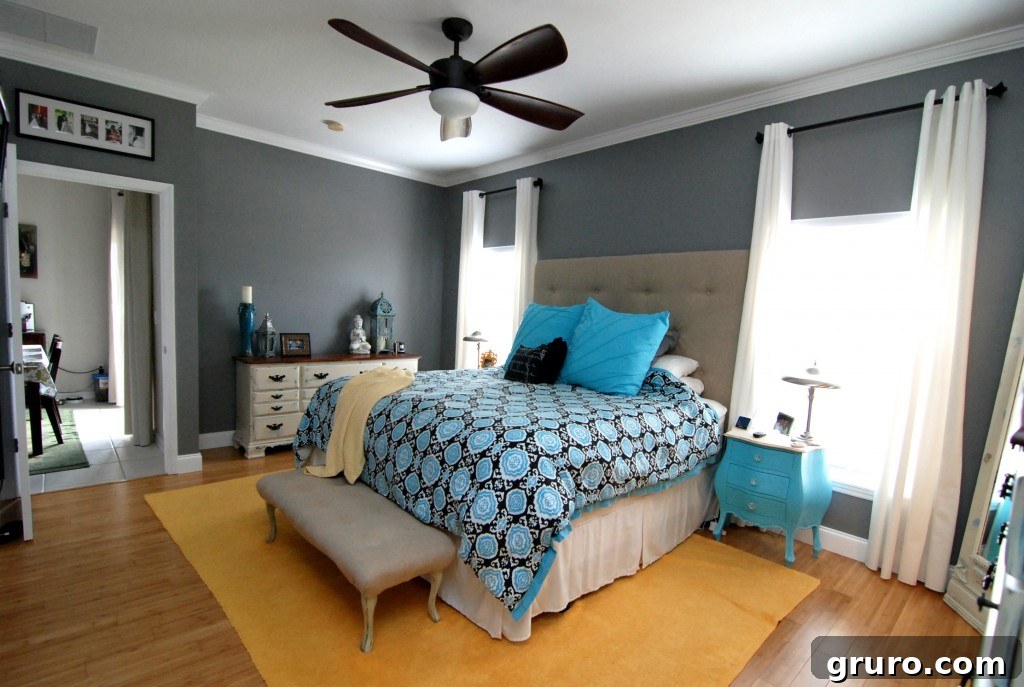 Elegant master bedroom showcasing a cohesive blue and gray color scheme