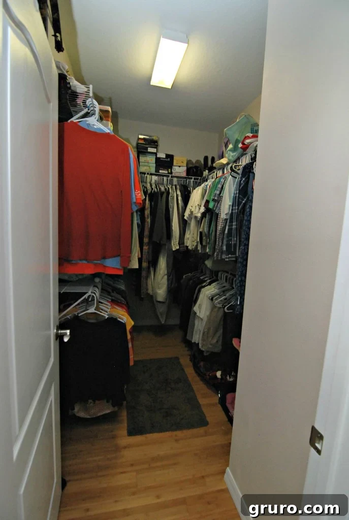 Organized master closet with various storage solutions