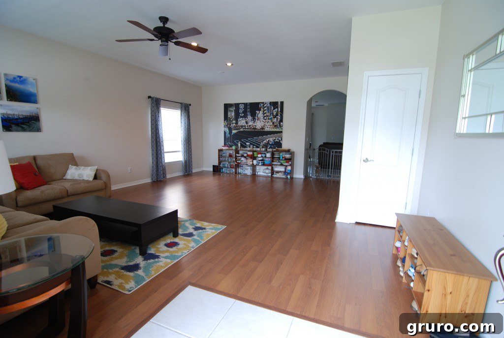 Elegant formal living room with a clear, spacious entryway, accentuating its grandeur