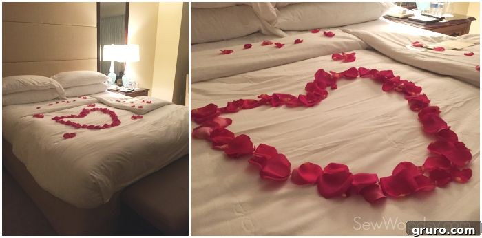 Romantic turndown service with rose petals beautifully arranged on the bed, creating a memorable ambiance.