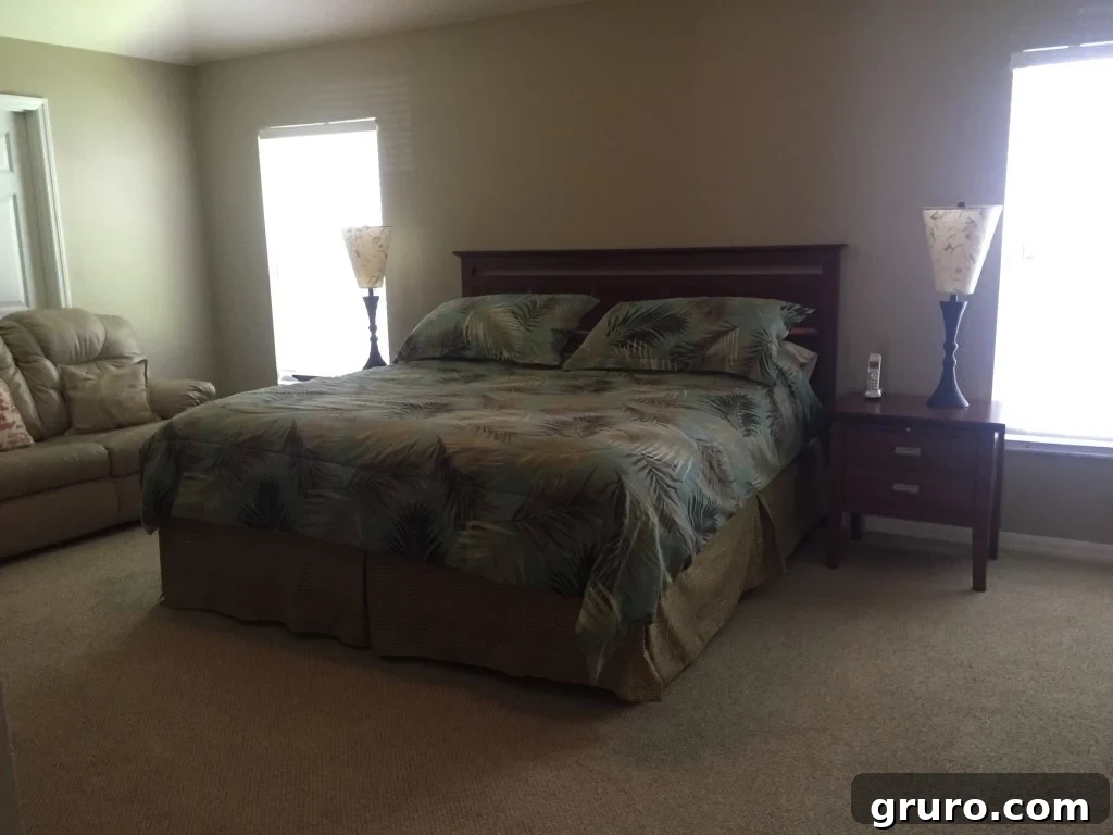 Spacious master bedroom with tray ceiling and renovation potential