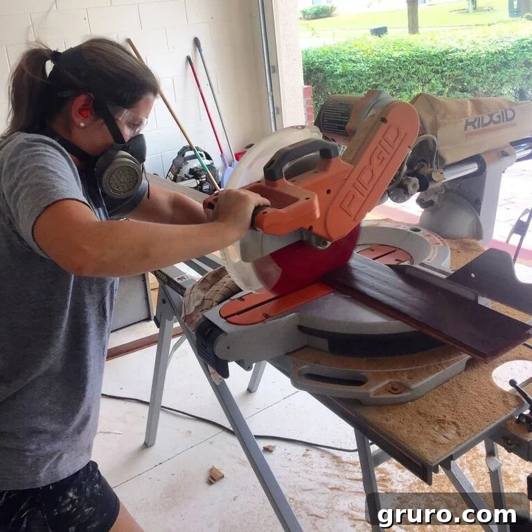 Transformation in Progress 13 Using a miter saw for precise cuts during hardwood floor installation