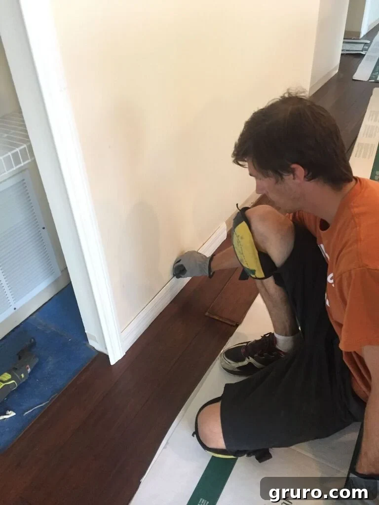 Transformation in Progress 17 Ensuring proper spacing for hardwood floors using a molding trick