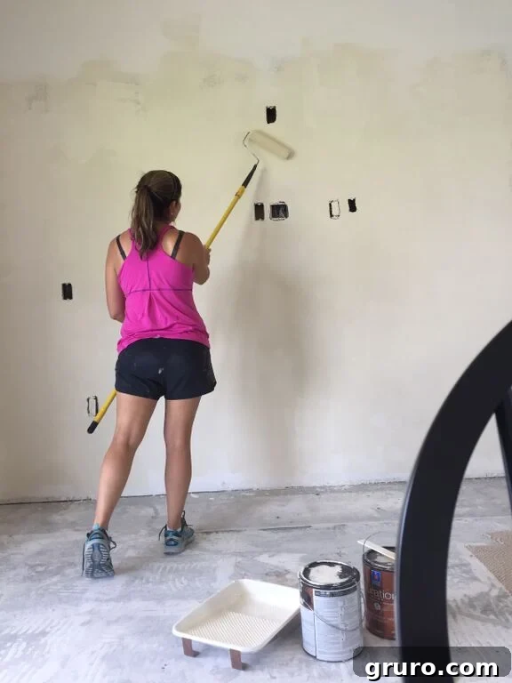Transformation in Progress 19 Painting new drywall with primer to ensure a smooth, lasting finish