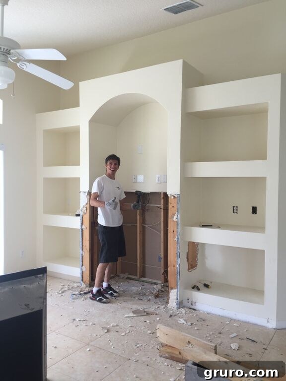 Transformation in Progress 5 Demolition of an outdated drywall entertainment center to open up living space